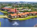 Stunning aerial view of waterfront townhomes featuring a community fountain and lush landscaping at 11 Franklin S Ct # C, St Petersburg, FL 33711