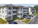 Well maintained building with decorative concrete railings, external stairways and ample parking at 1235 S Highland Ave # 2-207, Clearwater, FL 33756