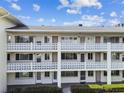Multi-level building with decorative concrete railings and exterior walkways to unit entries at 1235 S Highland Ave # 2-207, Clearwater, FL 33756