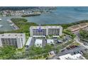 A condo building boasts waterfront views, lush landscaping, and convenient parking at 1332 Pasadena S Ave # 503, South Pasadena, FL 33707