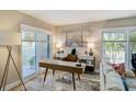 Bright office space with modern desk, stylish decor, and plantation shutters at 1480 Gulf Blvd # 109, Clearwater Beach, FL 33767