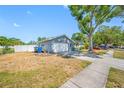The home has an attached two car garage and driveway; the front yard needs some TLC at 14884 Cromwell Dr, Clearwater, FL 33764