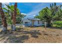 Cozy single-Gathering home with mature trees, a small porch, and a well-maintained lawn at 2001 29Th N Ave, St Petersburg, FL 33713