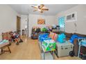 Spacious living room with hardwood floors and a ceiling fan, currently occupied at 2001 29Th N Ave, St Petersburg, FL 33713