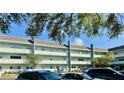 Multi-level condo building showcasing its architectural design, balconies, and convenient parking at 2254 Norwegian Dr # 46, Clearwater, FL 33763