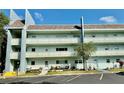 Exterior daytime view of the building featuring a mid-rise facade and parking at 2254 Norwegian Dr # 46, Clearwater, FL 33763