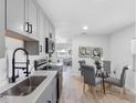 Bright kitchen showcases gray cabinetry, stainless appliances, and open layout to living spaces at 2322 21St S St, St Petersburg, FL 33712