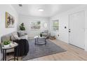 Cozy living room boasts neutral decor, lots of natural light, and modern finishes at 2322 21St S St, St Petersburg, FL 33712