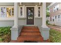 Elegant front entrance features classic columns and brick steps for a welcoming approach at 337 S Plant Ave, Tampa, FL 33606