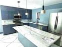Kitchen featuring modern stainless steel appliances, white marble countertops and a blue-grey accent wall at 3911 6Th W Ave, Palmetto, FL 34221