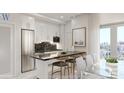 Modern kitchen with stainless steel appliances, dark marble countertops and island seating with a view at 411 E Shore Drive # 214, Clearwater Beach, FL 33767