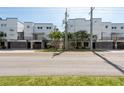 Modern townhouse complex features a row of units with sleek design and well-kept landscaping at 5008 S Macdill Ave # 10, Tampa, FL 33611