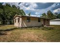 Charming single-story home featuring a well-maintained lawn, and a welcoming front entrance at 6423 Bass Rd, Weeki Wachee, FL 34607
