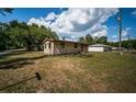 Charming single-story home featuring a well-maintained lawn, and a welcoming front entrance at 6423 Bass Rd, Weeki Wachee, FL 34607
