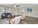 Cozy living room featuring stylish decor, hardwood floors, and a large window at 9136 42Nd N Ln, Pinellas Park, FL 33782