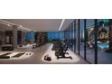 State-of-the-art gym with floor-to-ceiling windows and a pool view at 1101 E Jackson St # 2101, Tampa, FL 33602