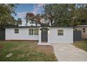 Charming single-story home featuring a freshly painted exterior, updated windows, and a well-manicured front yard at 11747 104Th N St, Largo, FL 33773