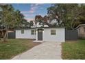 Charming single-story home featuring a freshly painted exterior, updated windows, and a well-manicured front yard at 11747 104Th N St, Largo, FL 33773