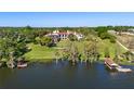 Beautiful lakeside estate with rolling lawn and private dock at 11865 Fort King Hwy, Thonotosassa, FL 33592