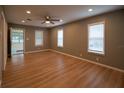 Spacious living room with gleaming wood floors, neutral walls, and ample natural light at 1716 11Th N Ave, St Petersburg, FL 33713
