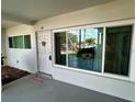 Entrance with a decorative door and large window at 2020 World Parkway Blvd # 14, Clearwater, FL 33763