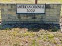 Sign identifying the American Colonial community built in 2020 at 2020 World Parkway Blvd # 14, Clearwater, FL 33763
