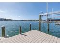 An updated private boat dock with a boat lift, offering picturesque waterfront views at 2140 Dolphin S Blvd, St Petersburg, FL 33707