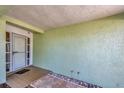 Front entry with decorative tiles, a light green wall and a white door at 3414 Rankin Dr, New Port Richey, FL 34655