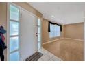 Inviting living room with wood-look flooring and a window with decorative curtains at 3414 Rankin Dr, New Port Richey, FL 34655