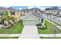 Aerial view of home showing front yard, driveway, and two-car garage at 3503 Diamond Leaf Ct, Valrico, FL 33594