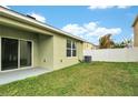 The backyard features a grassy area and is enclosed by a white privacy fence at 3503 Diamond Leaf Ct, Valrico, FL 33594
