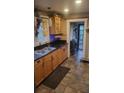 Charming kitchen featuring stainless steel appliances and a unique tile floor at 4303 N 10Th St, Tampa, FL 33603