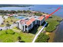Stunning waterfront condo with terracotta tile roof, lush landscaping and community pool and tennis courts at 433 Mariner Dr # 433, Tarpon Springs, FL 34689