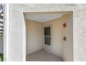 Condo entryway nook with access to an exterior staircase and the unit's front door at 6011 Bahia Del Mar Blvd # 158, St Petersburg, FL 33715
