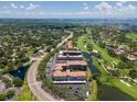 Aerial view of Golfview Condominiums highlighting the community's golf course and water views at 6150 Gulfport S Blvd # 306, Gulfport, FL 33707
