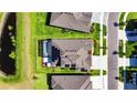 Aerial view of a home, revealing a backyard with a screened-in pool at 6253 Hidden Branch Dr, Apollo Beach, FL 33572