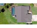 An overhead shot of a home's roof and screened pool, showcasing its well-maintained exterior and outdoor amenities at 709 Sportsman Park Dr, Seffner, FL 33584