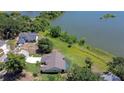 Stunning aerial view of a home with a private pool and adjacent lake access at 709 Sportsman Park Dr, Seffner, FL 33584