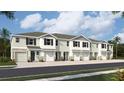 New townhome with stone accents, garage, and neutral color palette, providing a modern and inviting curb appeal at 11406 Velvet Apricot Dr, Land O Lakes, FL 34638