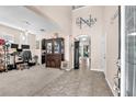 Inviting foyer with a high ceiling, archways, and neutral decor, creating a warm entry at 11525 Scarlet Ibis Pl, Riverview, FL 33569