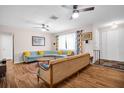 Inviting living room with hardwood floors, comfortable seating, and plenty of natural light at 12965 Ridge Rd, Largo, FL 33778