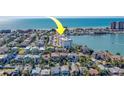 Aerial view of neighborhood showing numerous single Gathering houses near water and condo complex at 17735 Gulf Blvd # 202, Redington Shores, FL 33708