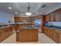 The gourmet kitchen offers custom cabinets, an island, and modern stainless steel appliances at 17735 Gulf Blvd # 202, Redington Shores, FL 33708