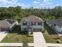 This aerial view shows a charming home and surrounding landscape at 1823 Moon Cactus Ct, Ruskin, FL 33570