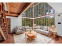Bright living room featuring floor-to-ceiling windows and comfortable seating at 18816 Carr Dr, Lutz, FL 33559