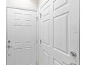 A clean and bright hallway with multiple white doors at 2131 River Turia Cir, Riverview, FL 33578