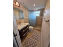 Updated bathroom featuring tile walls, modern fixtures, and a glass-enclosed shower at 2310 Medford Ln, Brandon, FL 33511
