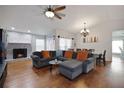 Inviting living room with cozy fireplace, comfortable seating, and stylish hardwood floors at 4034 Paddlewheel Dr, Brandon, FL 33511