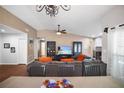 Inviting living room with a beautiful stone fireplace and large comfortable seating at 4034 Paddlewheel Dr, Brandon, FL 33511