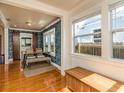 Elegant dining room featuring hardwood floors, stylish wallpaper, and ample natural light at 4334 18Th N St, St Petersburg, FL 33714